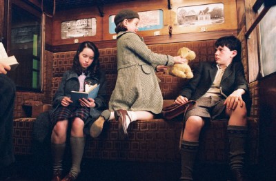 Lucy offers Edmund her teddy bear Lucy offers Edmund her teddy bear