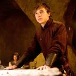 Caspian and Cornelius sitting together in the background